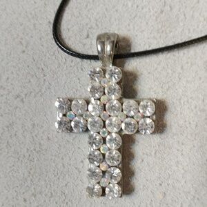 Sparkling rhinestone cross  measuring 2" x 1.25"  18" black cord